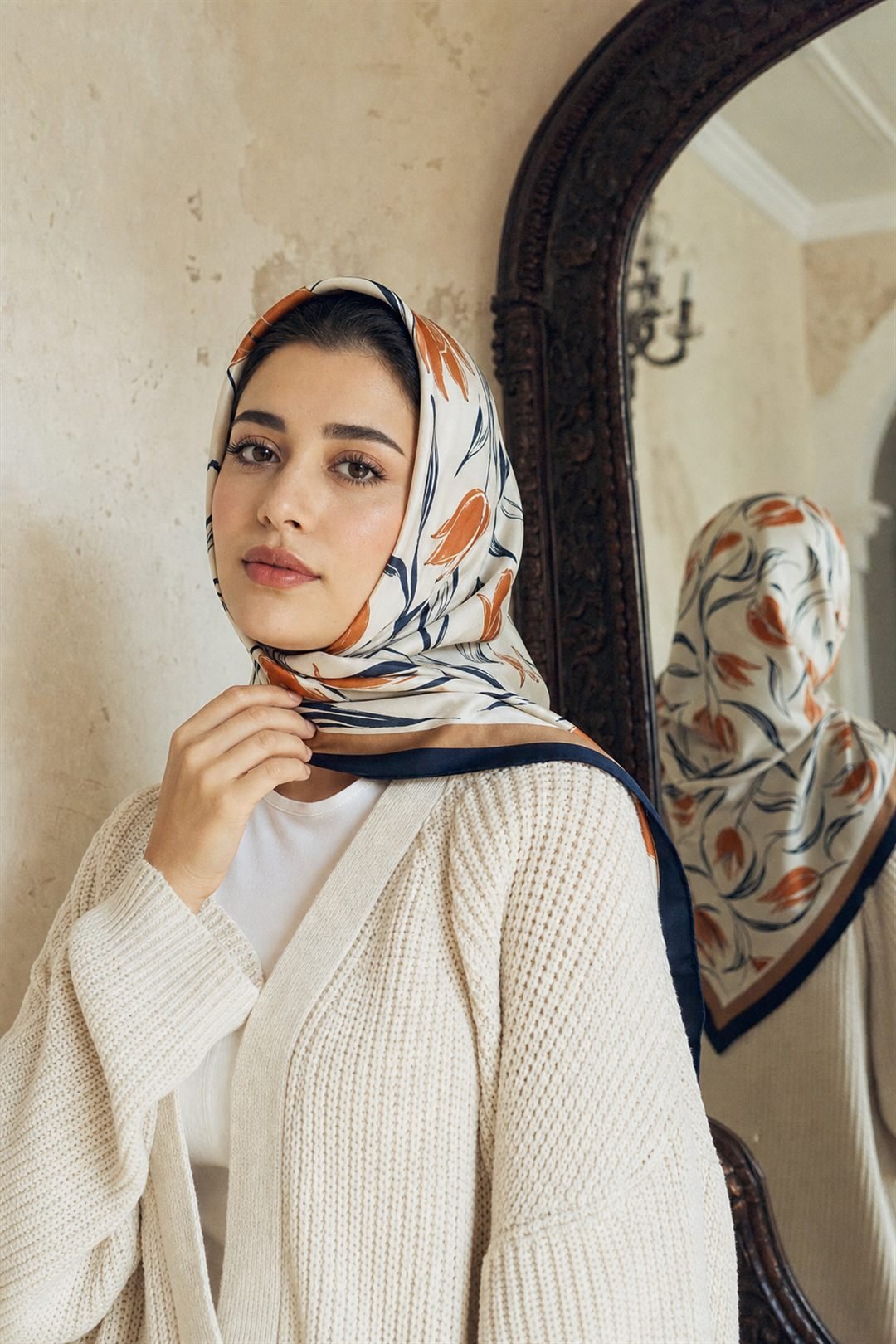 Model wearing a TOLOTEX silk-twill scarf in navy and burnt orange